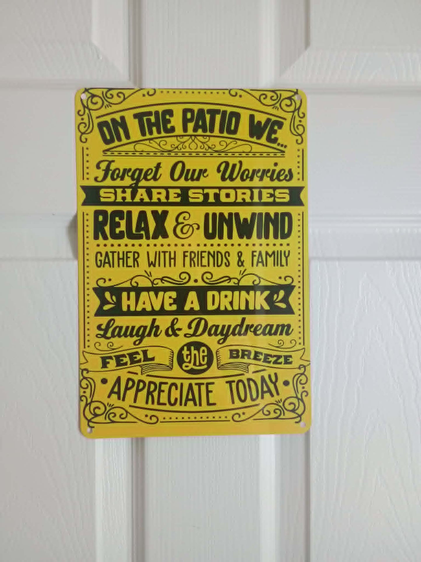 Wall sign~On the porch