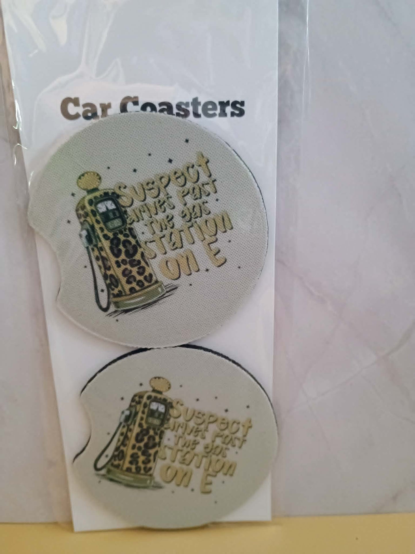Car coasters~Suspect drives past the gas station on E