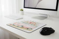 Mouse pad with a pink van and floral design, featuring a Targus mouse.