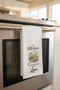 Kitchen towel with decorative text and illustration on a rack